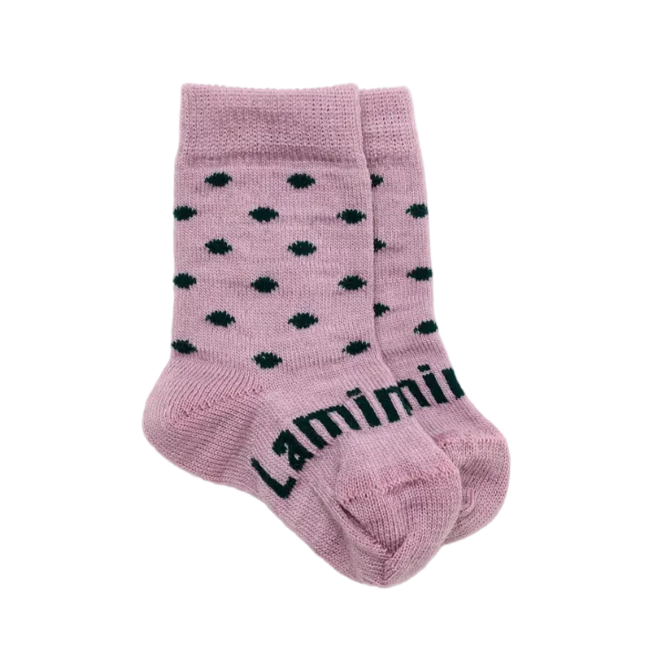 A pair of purple lilac merino wool knit baby socks with black polka dots and the brand name 'Lamington' printed on the foot, displayed on a clean white background.
