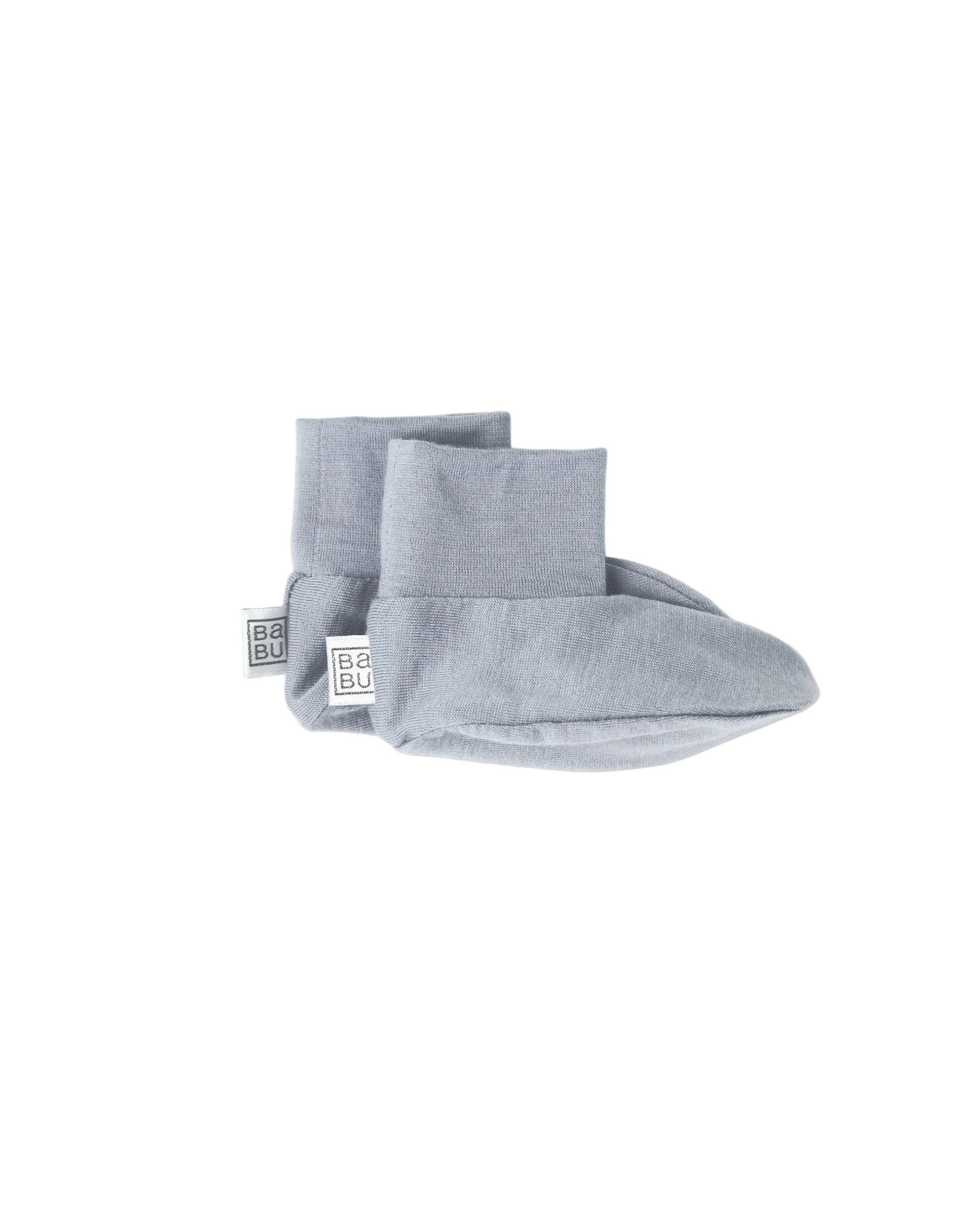 Pair of blue grey 100% merino wool baby booties on a white background