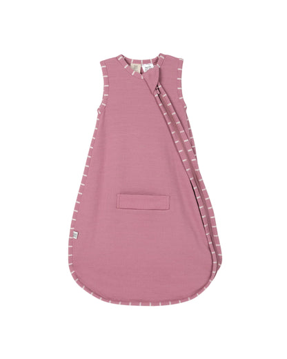 Pink baby 100% merino wool sleeping bag with 2-way zip, pram and carseat holes and subtle white stripes on trim on a light gray background