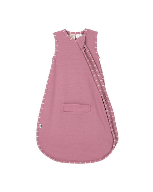 Pink baby 100% merino wool sleeping bag with 2-way zip, pram and carseat holes and subtle white stripes on trim on a light gray background