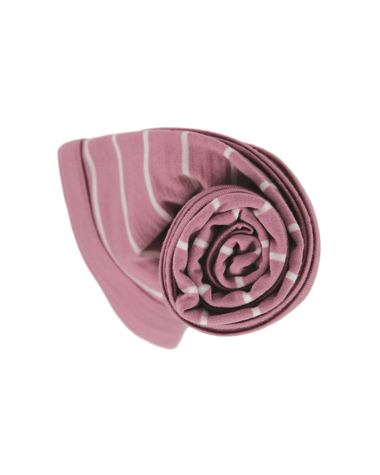 Rolled-up pink and white striped merino wool swaddle blanket