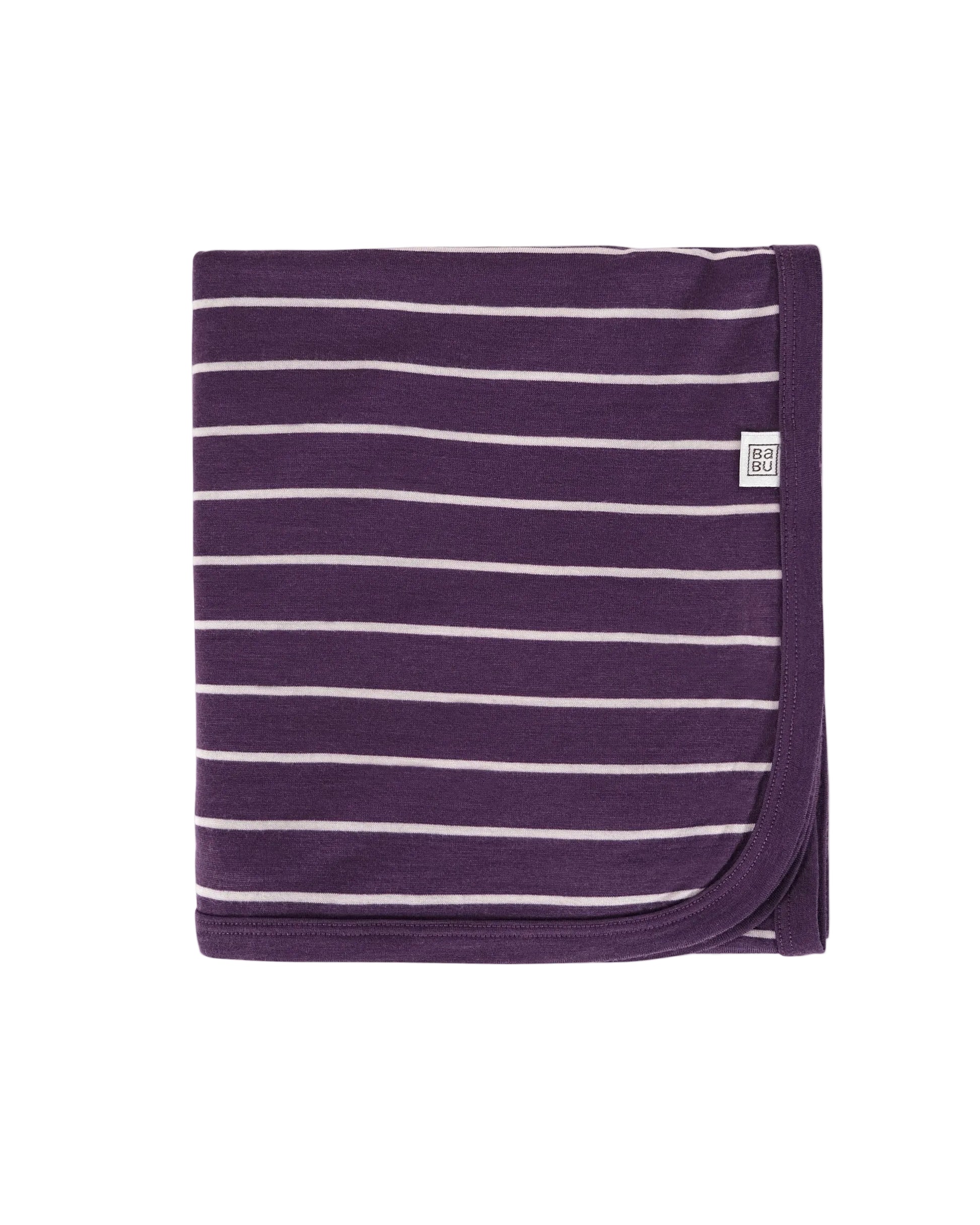 Purple and white striped 100% merino wool lightweight blanket with a small Babu brand logo on a light gray background