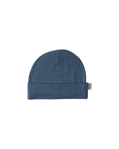 Blue merino wool baby beanie hat on a white background